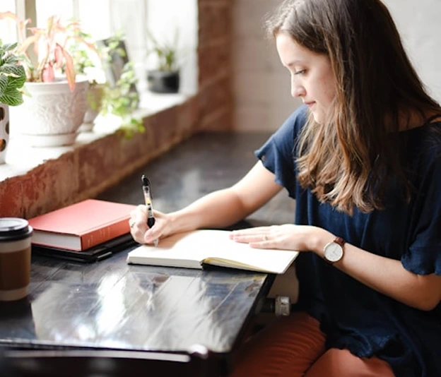 AA student, sitting and working on a computer.