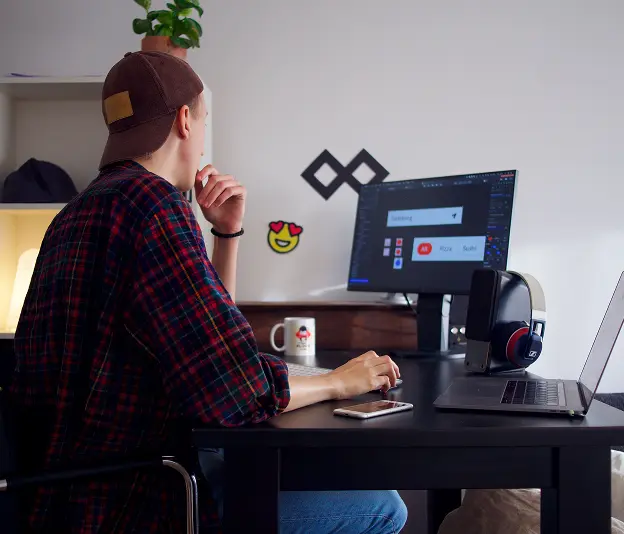 AA student, sitting and working on a computer.