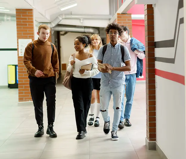 University students walking and chatting.